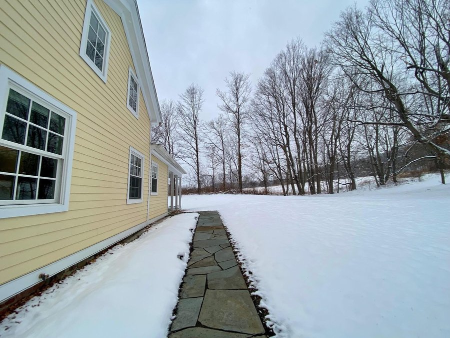 Snow melting on pavers in a walkway in Chatham, NY.
