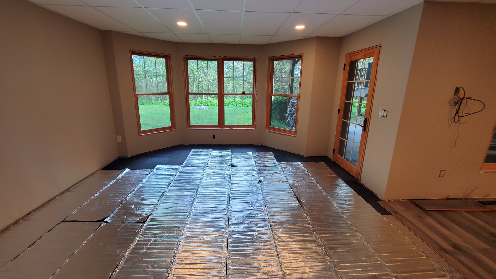 Laminate install with environ flex roll in basement (3)