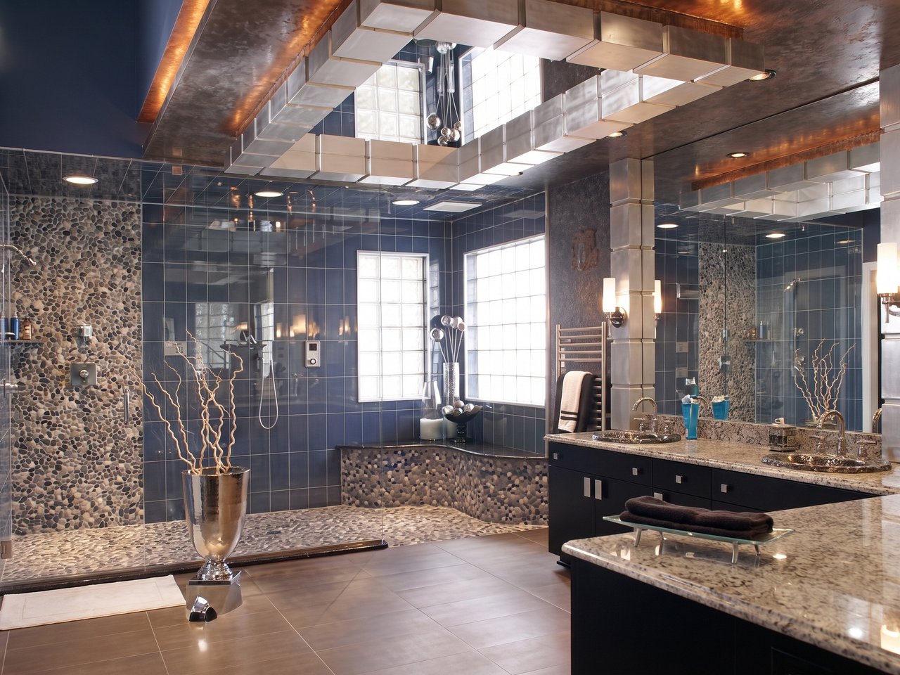 Heated stone floor in master bath with glass shower and vanity