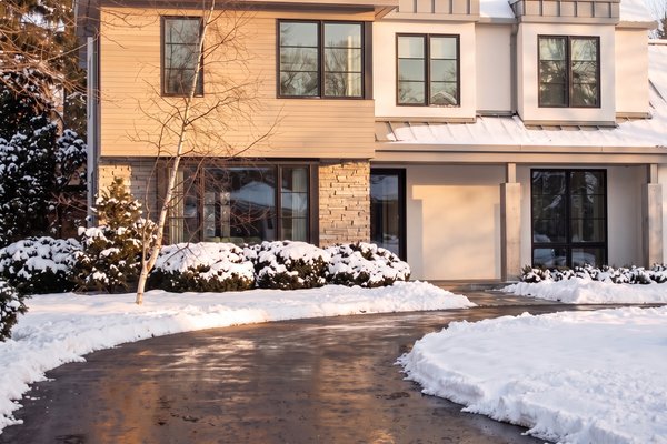 Modern House With Asphalt Driveway And Radiant Snow Melting System