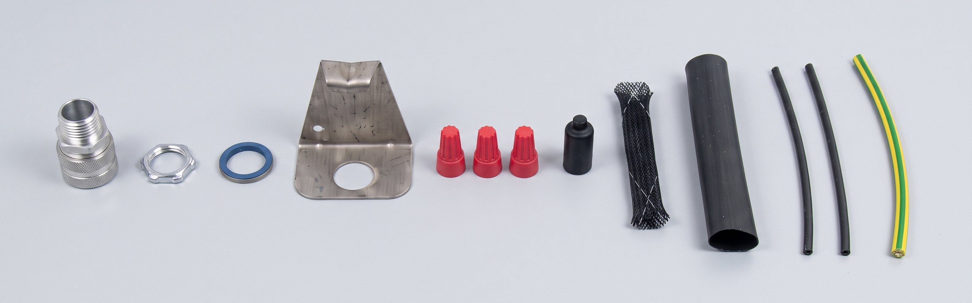 Roof and gutter deicing power connection kit components: cable gland, locknut, O-ring, mounting bracket, wire nuts, end cap, braided sleeve, heat shrink tubes and grounding wire