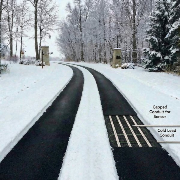 A cutaway view of an asphalt snow melting system featuring a heating mat with green heating cable embedded beneath the driveway surface.
