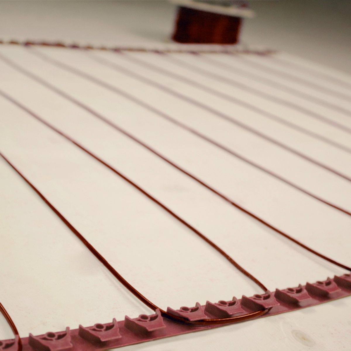 Angled Shot of TempZone Floor Heating Cable with Fixing Strips