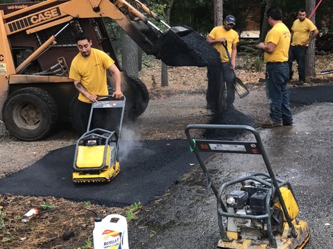 applying asphalt basecoat on driveway Step 3: Base coat of asphalt