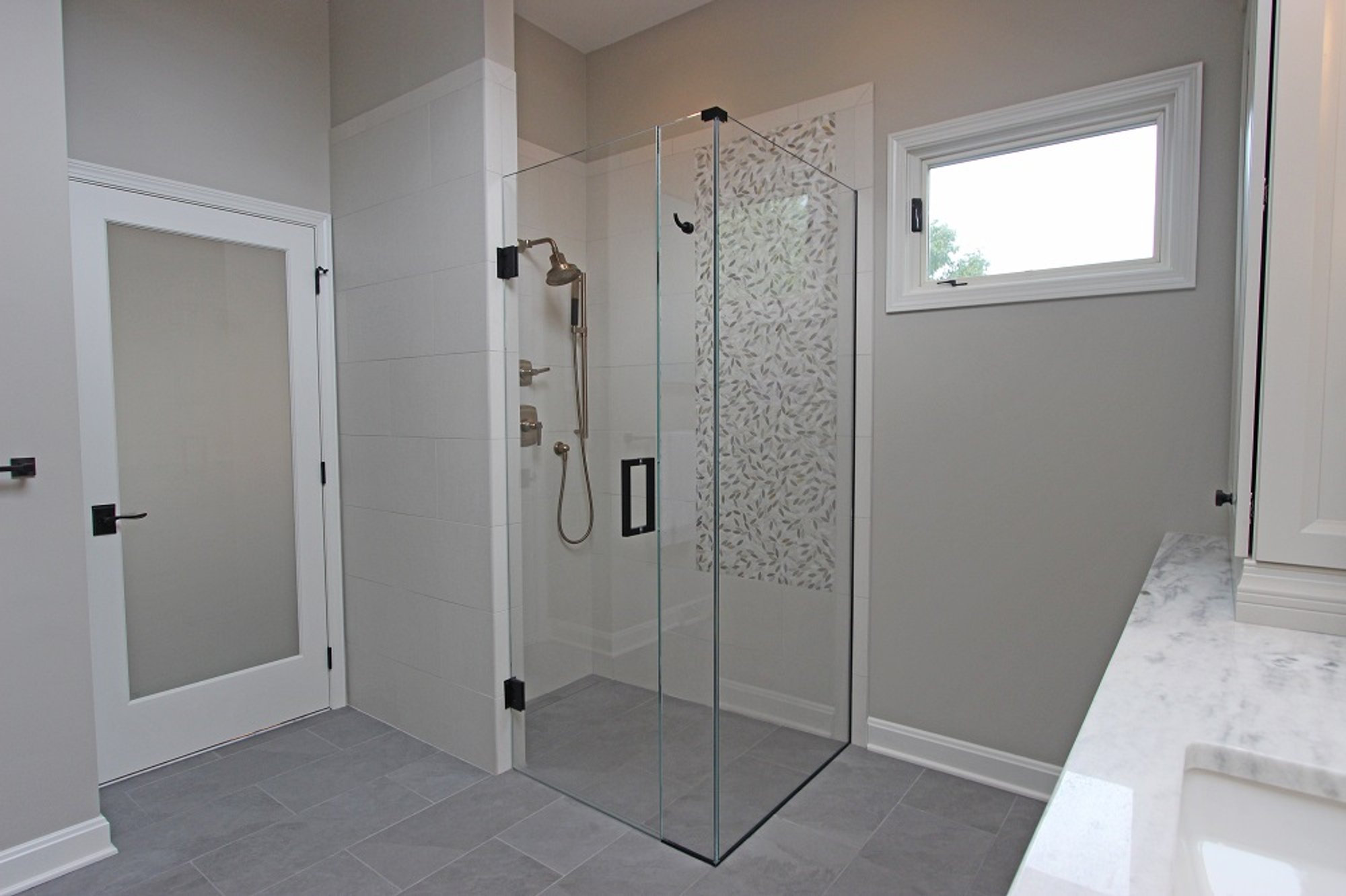 Architectural Justice remodel of bathroom with curb-less shower and TempZone heated floors