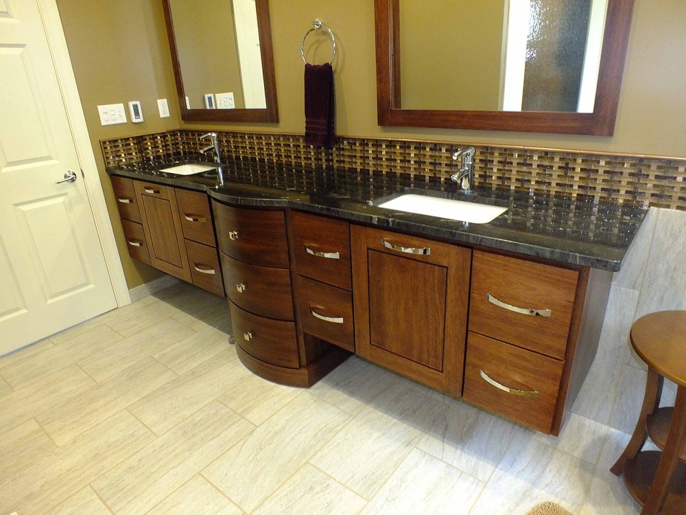 Asian-inspired bathroom with custom radiant heated flooring and modern design