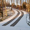 Asphalt Driveway with Snow Melting Tire Tracks