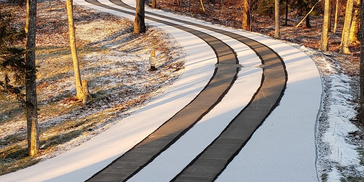 Asphalt Driveway with Snow Melting Tire Tracks