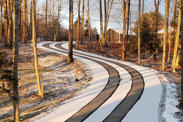 Asphalt Driveway with Snow Melting Tire Tracks