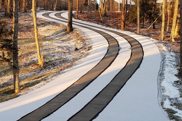 Asphalt Driveway with Snow Melting Tire Tracks