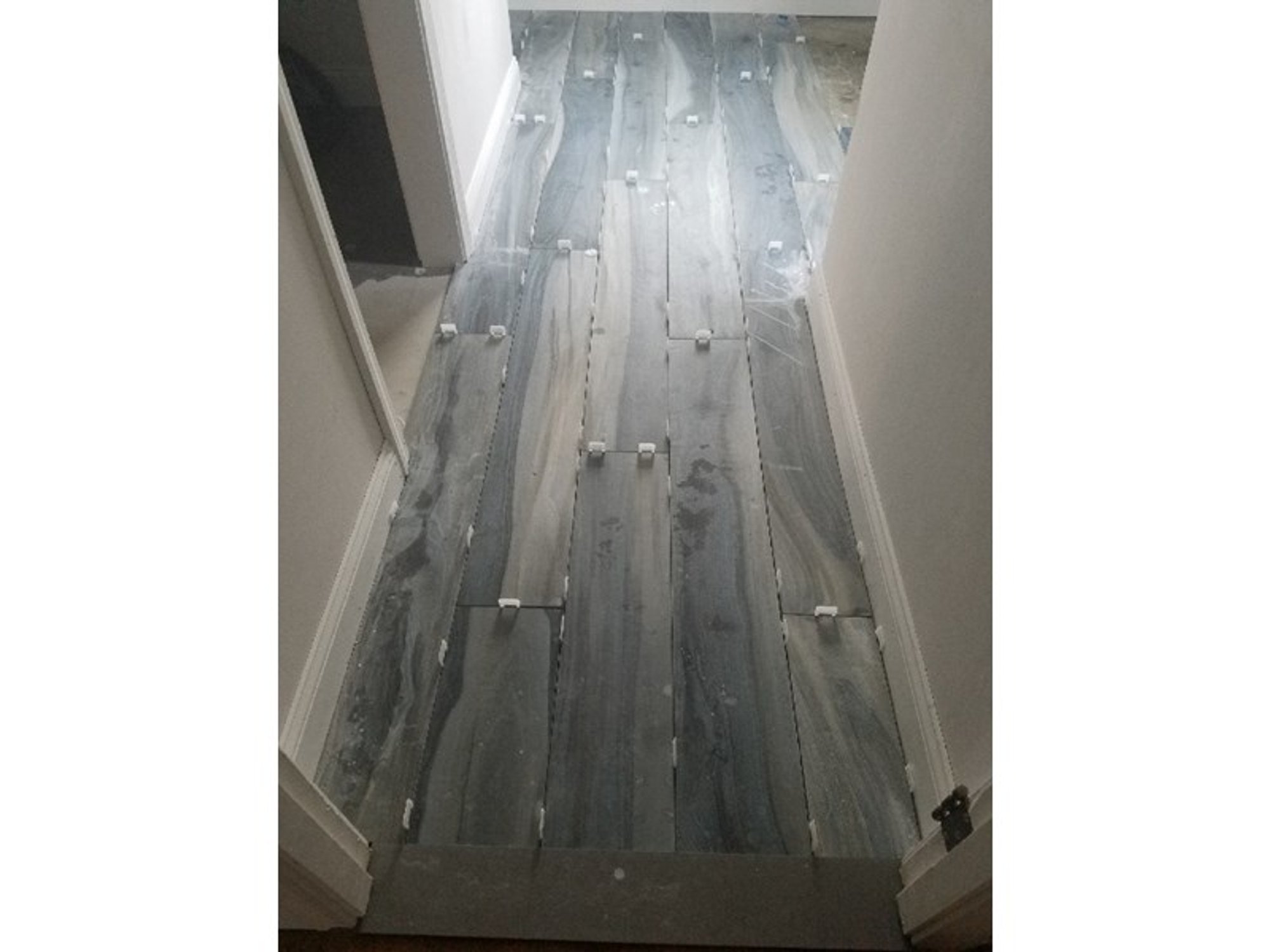 Attic hallway with heated grey tile flooring PROVIDENCE, RI