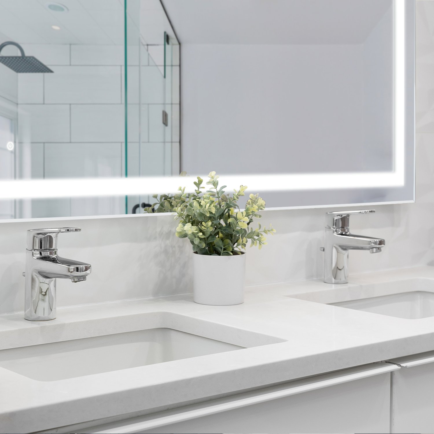 LED strip lighting installed under bathroom cabinets, creating a warm, spa-like glow for both ambiance and task lighting.