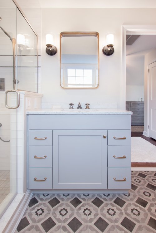 Bathroom vanity in master bathroom with heated tile floor