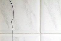 Bathroom with cracked tile floor