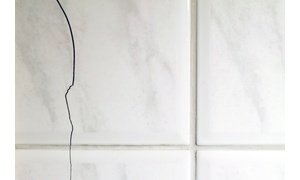 Bathroom with cracked tile floor