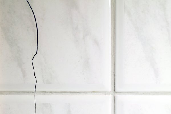 Bathroom with cracked tile floor