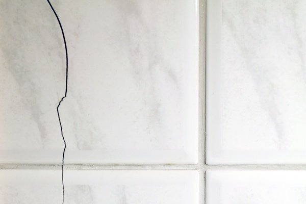 Bathroom with cracked tile floor