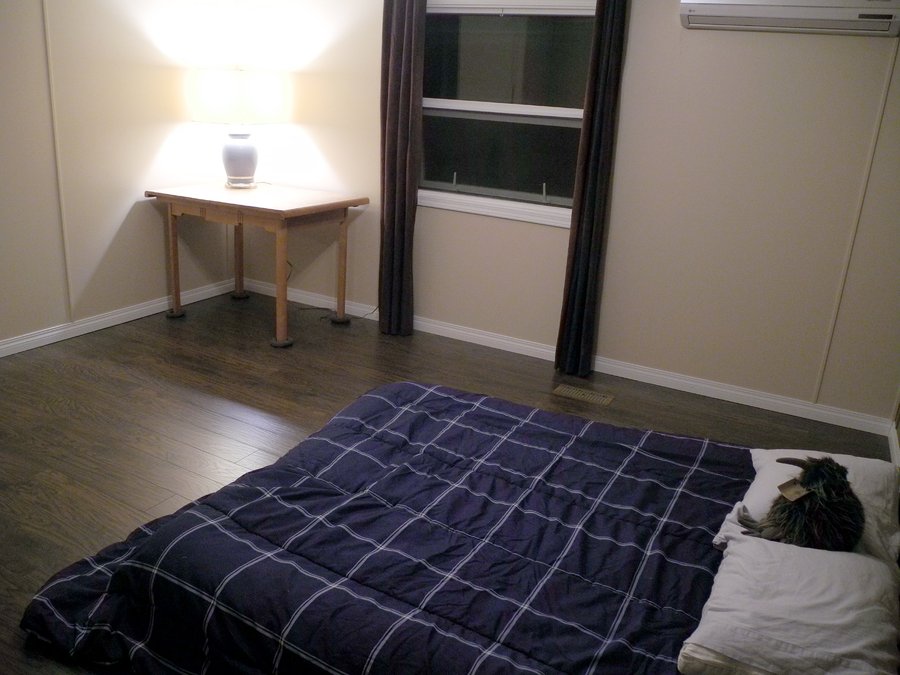Bedroom with Heated laminate floors after shot