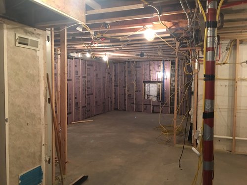 Before shot for remodeling project with wine cellar kitchen and bar by Architectural Justice