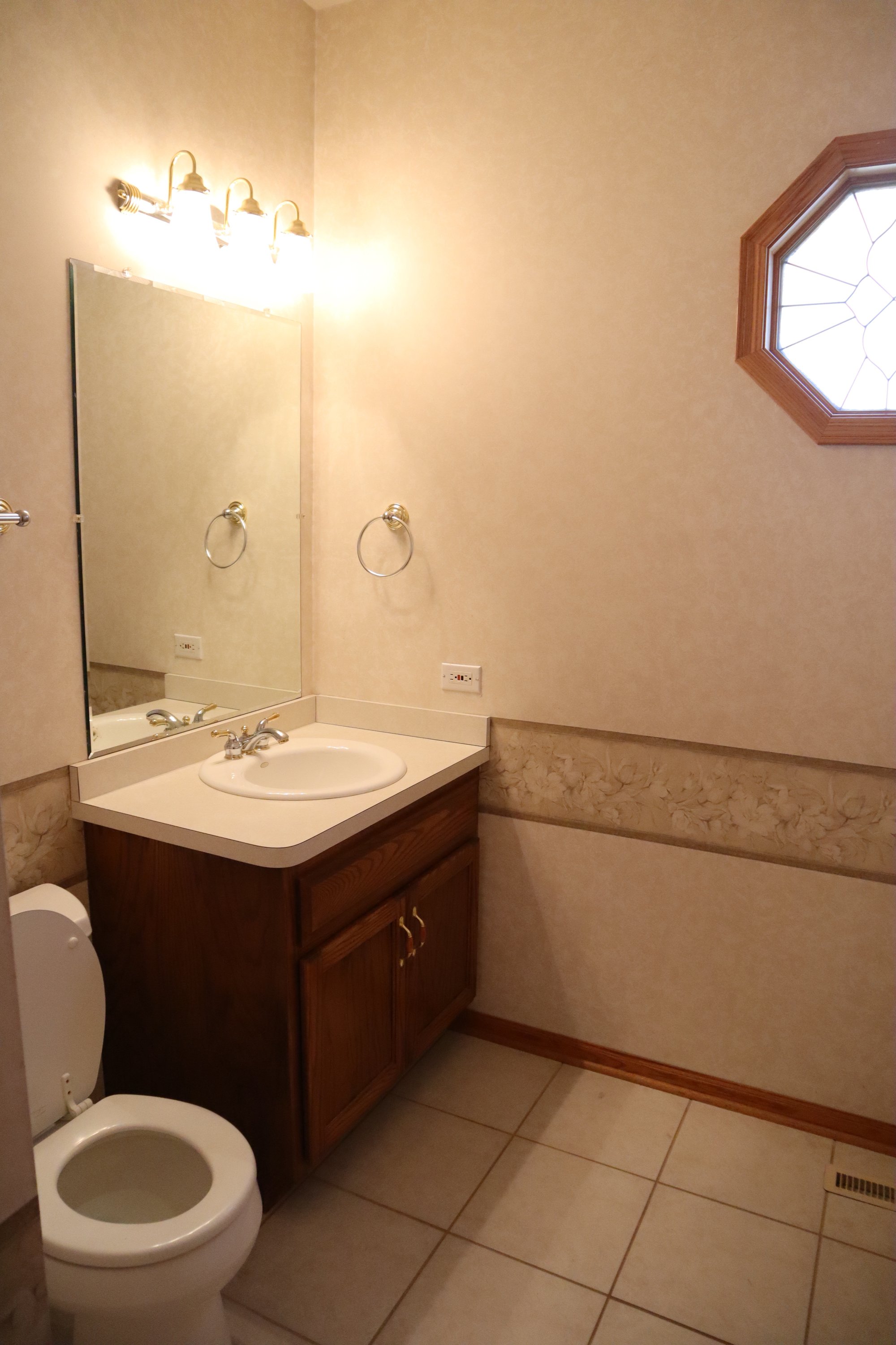 Before shot of powder room for Liz Dineen project OAK LAWN, IL