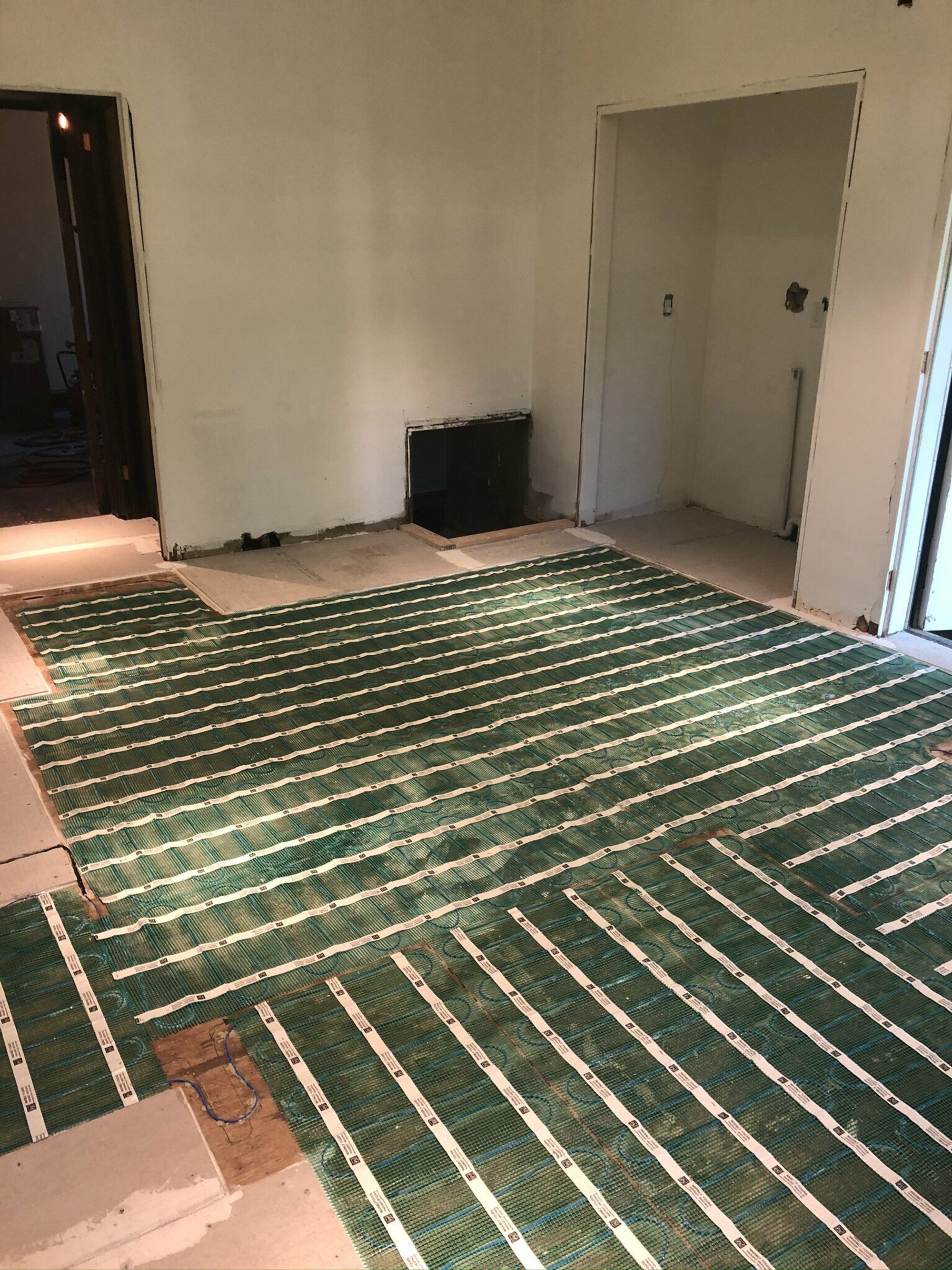 Brook & Stone Kitchen Remodel with electric floor heating with rolls laid out
