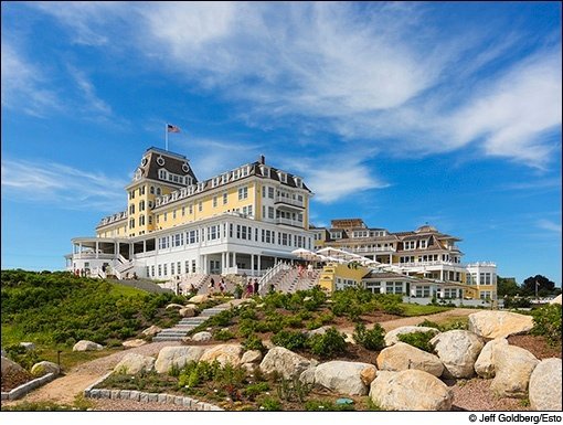 The Victorian-style Ocean House Hotel and Residences in Watch Hill, Rhode Island, featuring landscaped grounds with stone steps and boulders.