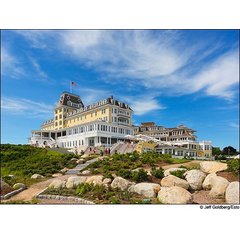 The Victorian-style Ocean House Hotel and Residences in Watch Hill, Rhode Island, featuring landscaped grounds with stone steps and boulders.