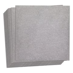 A stack of square CeraZorb thermal insulation underlayment sheets for electric radiant floor heating systems.