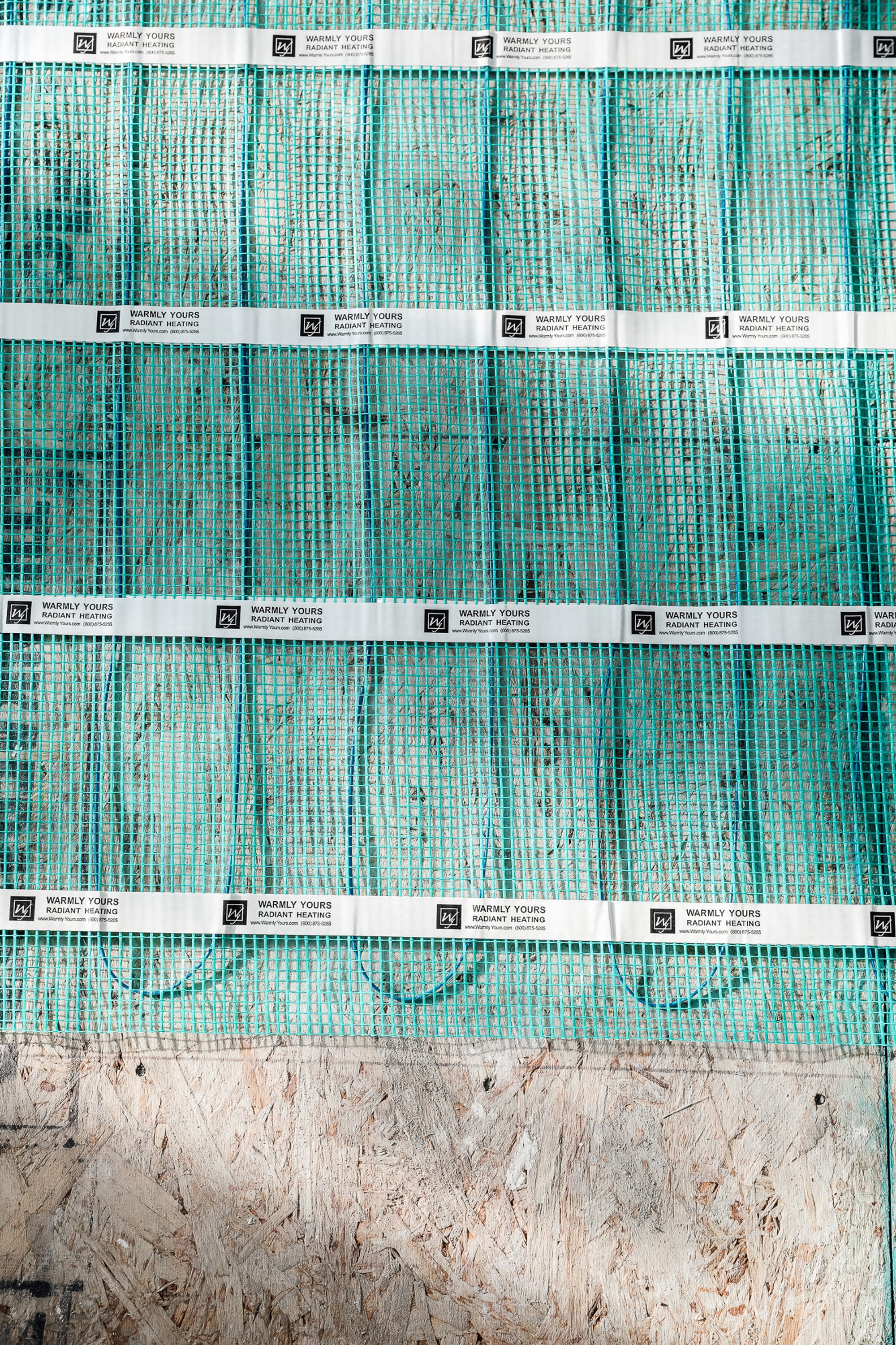 Chris Loves Julia Installation of Floor Heating Under Tile for Dining Room mat close up