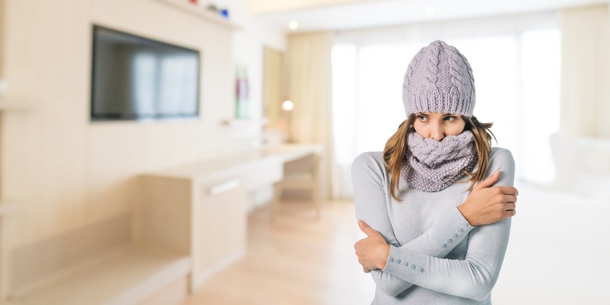 Cold woman in living room