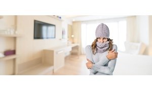 Cold woman in living room