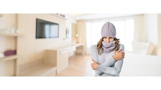 Cold woman in living room