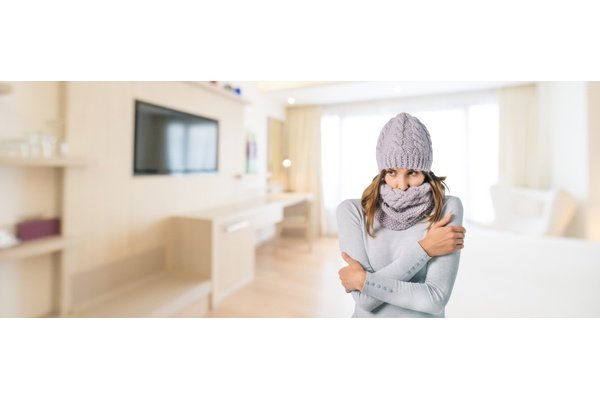 Cold woman in living room