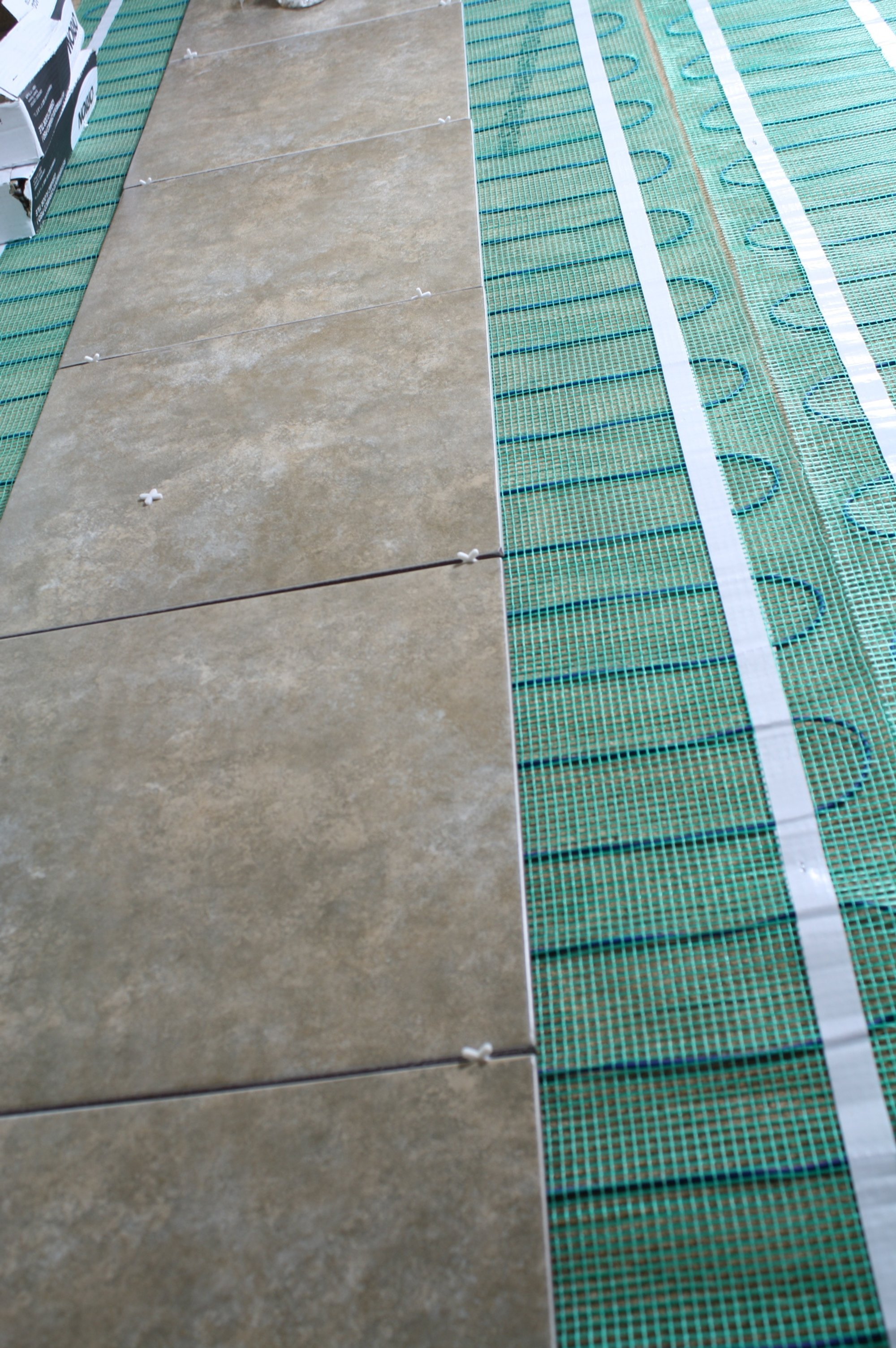 Cork underlayment installation with tempzone flex roll under tile