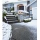 Decorative concrete stairs and driveway with snow