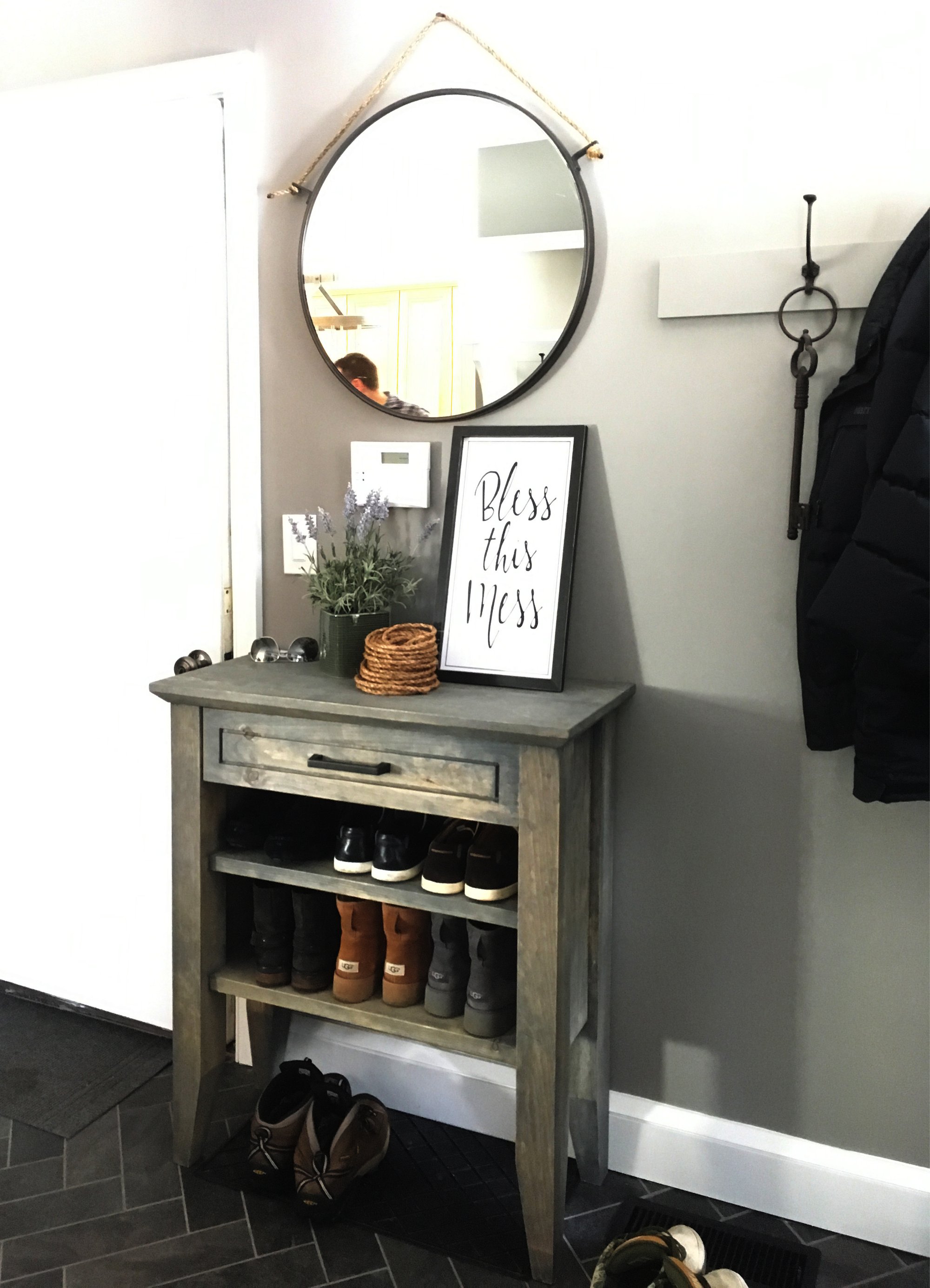 Entryway for mudroom with heated black tile floors