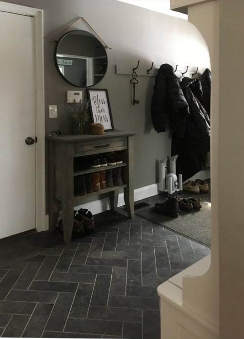 Entryway mudroom with heated tile herringbone floors