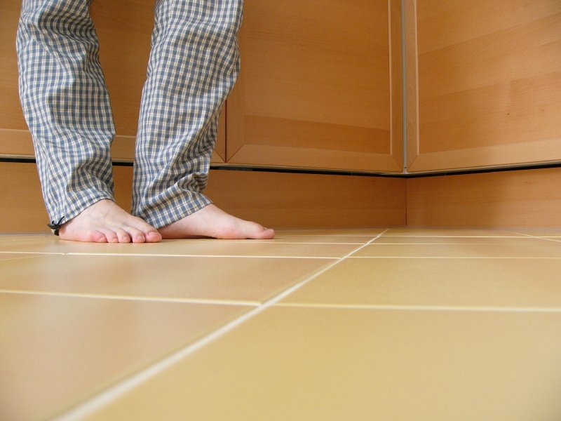 Feet Kitchen Tiles Stock Photo