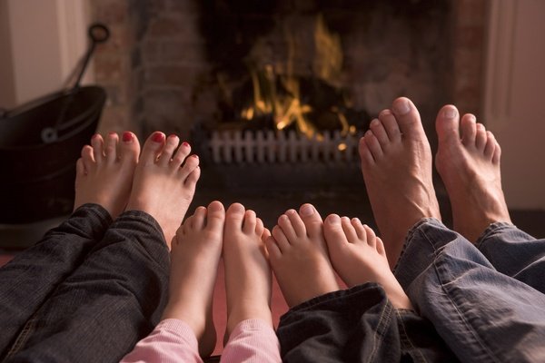 Feet warming in front of the fireplace