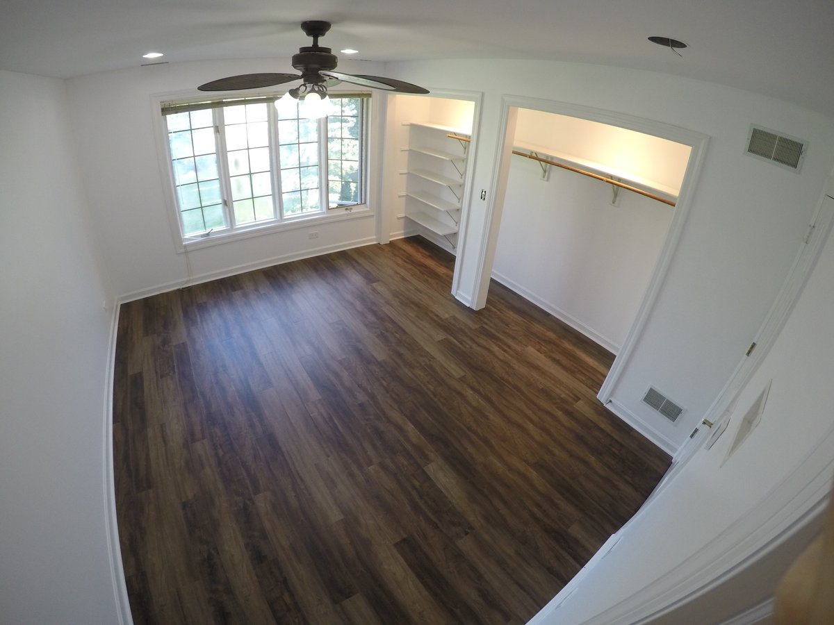 Bedroom with LVT and radiant floor heating in Kildeer, IL
