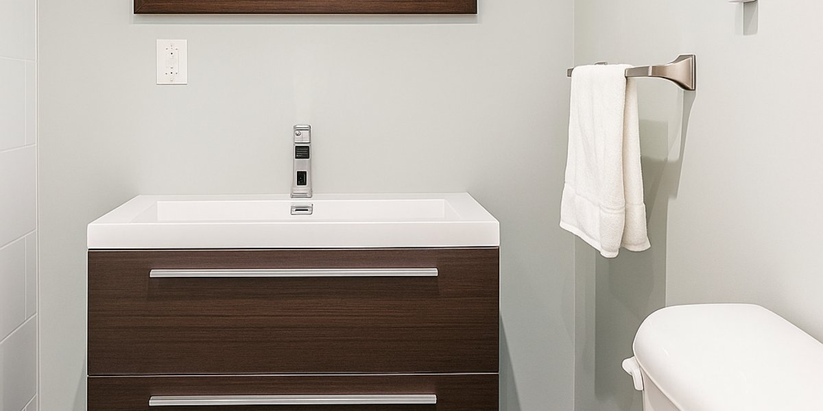 Finished basement bathroom with a 3' x 8' TempZone Floor Heating Mat