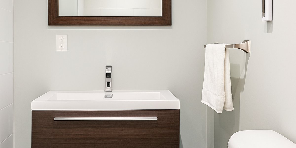 Finished basement bathroom with a 3' x 8' TempZone Floor Heating Mat