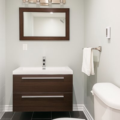 Finished basement bathroom with a 3' x 8' TempZone Floor Heating Mat
