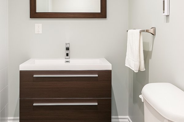 Finished basement bathroom with a 3' x 8' TempZone Floor Heating Mat