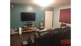 Finished media room with heated LVT floors
