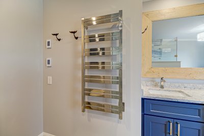 The Ultimate Wilmington Retreat: Coastal Chic Bath Design with Floor Heating and Milan Towel Warmer