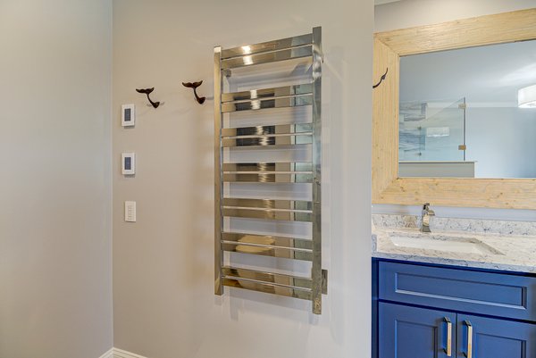 The Ultimate Wilmington Retreat: Coastal Chic Bath Design with Floor Heating and Milan Towel Warmer