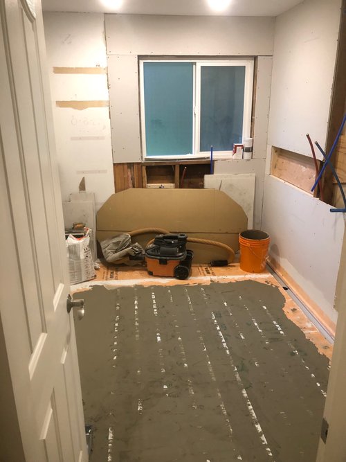 Floor heating mat installation for bathroom floor and walk-in shower