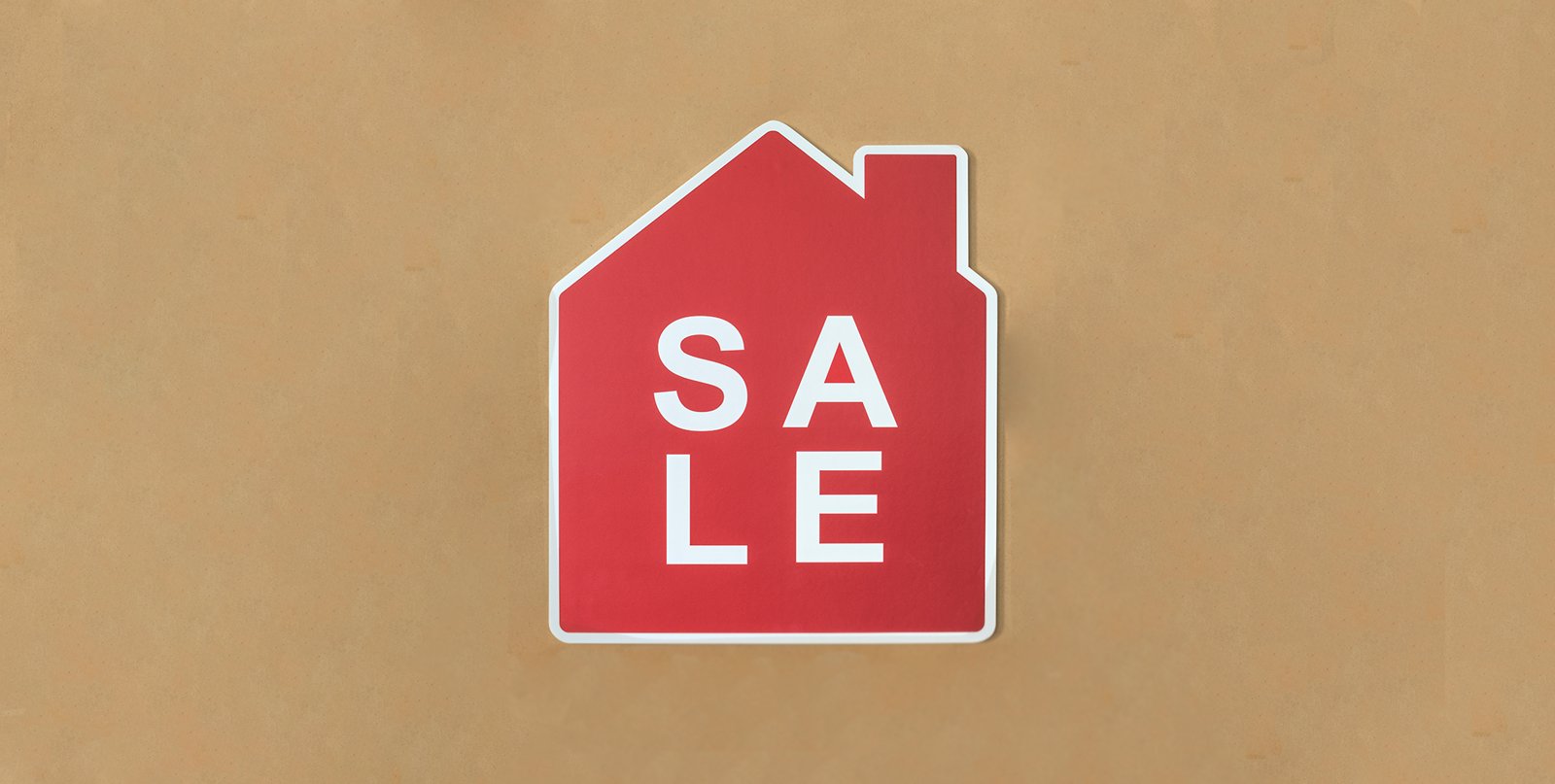 A red house-shaped sale banner with white text on a textured tan background.