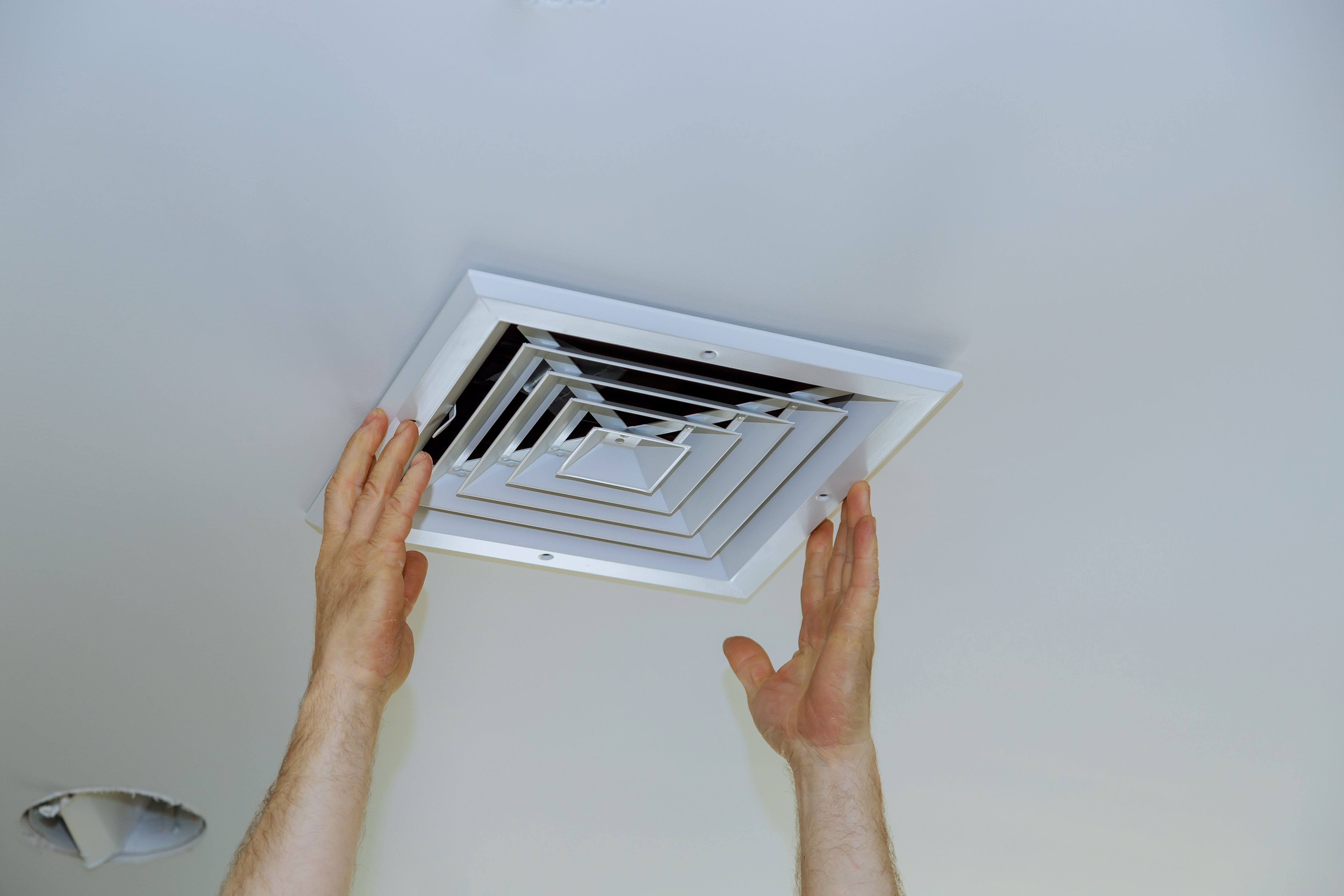 Forced air vent being installed